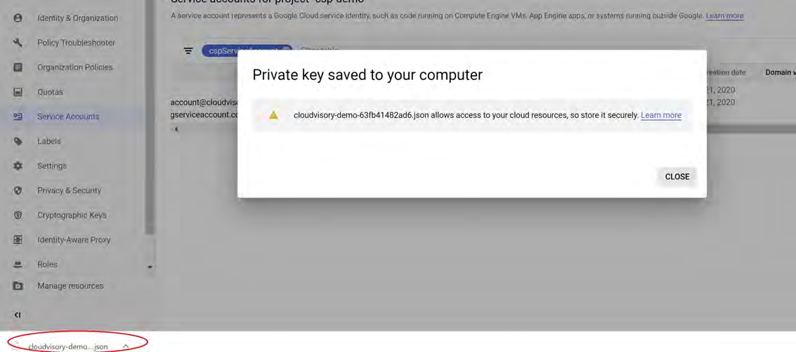 Google Cloud Console screen showing a modal titled Private key saved to your computer with a downloaded JSON filename circled at the bottom-left of the browser window