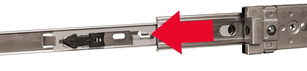 Inner rail assembly showing the three rail segments with a large red arrow pointing to the rail-release arrow located between the second and third extended rails.