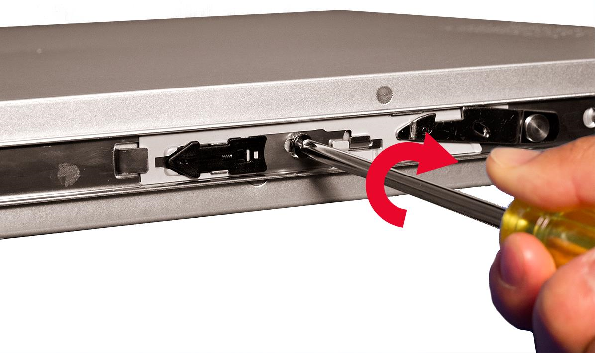 A close-up of a hand using a screwdriver to tighten a screw on an inner rail of the appliance; a red curved arrow indicates the rotational direction.