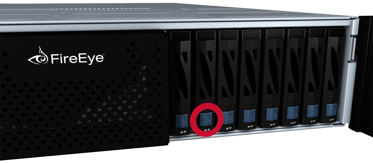 Close-up of the disk drive bay area showing the navy blue release button on the drive carrier circled in red.