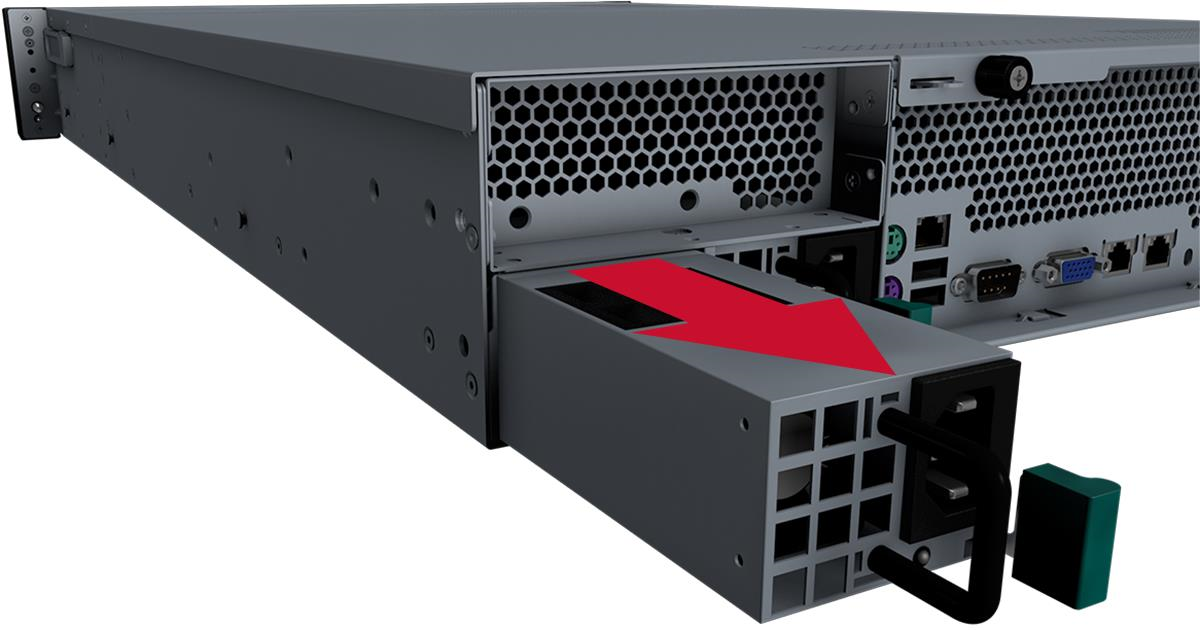 Rear of a rack appliance with the power supply unit partially removed; a large red arrow indicates the direction to pull the PSU, showing metal chassis, ventilation honeycomb, connectors, and a black handle with a green release piece.