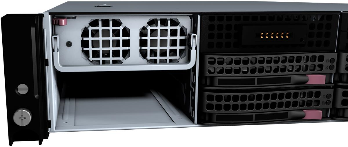 Close-up of a server chassis interior showing an empty power‑supply bay with two cooling fans above and drive bays to the right; demonstrates inserting a replacement PSU into the slot guides until the latch clicks.