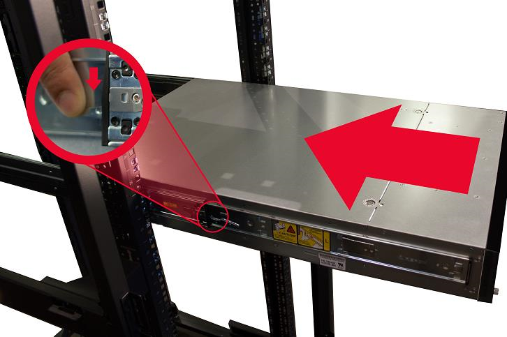 Appliance mounted in the rack with a large red arrow indicating the direction to push; inset circular close-up showing a finger pressing the rail-release notch