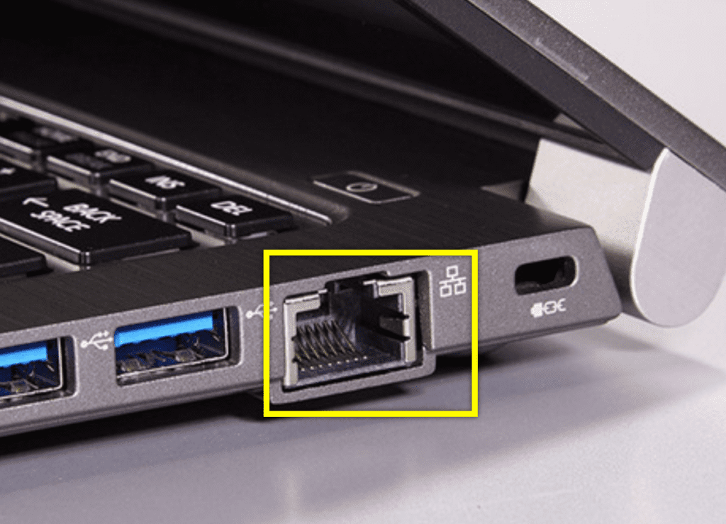 Close-up of a laptop's Ethernet port and USB connections on the side.