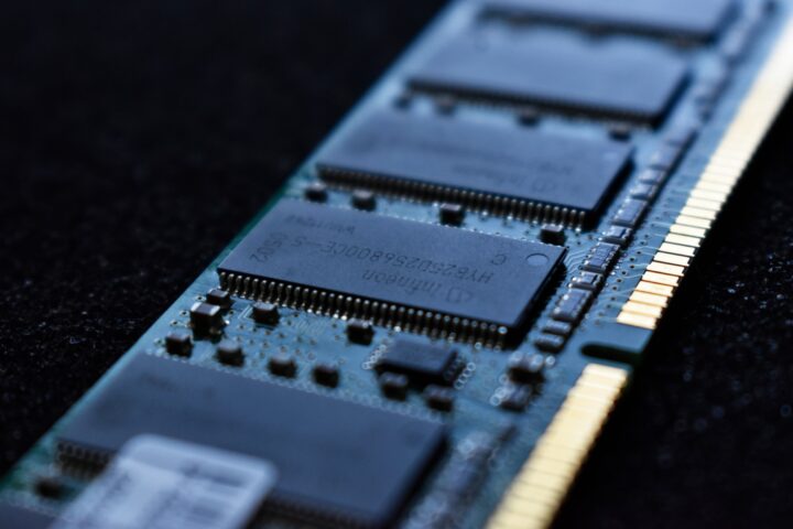 Close-up of a computer RAM module showcasing its intricate circuitry and memory chips.